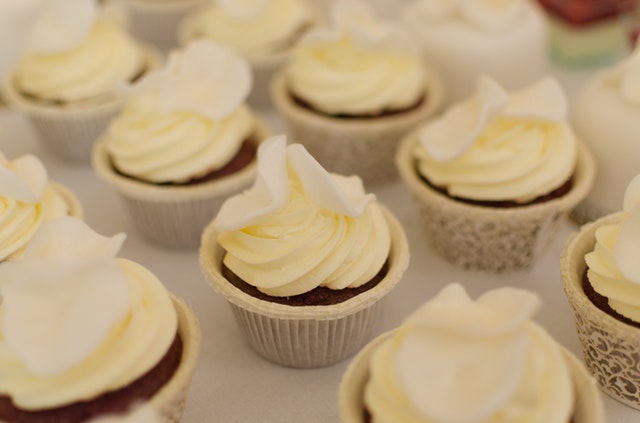Close-up shot of chocolate cupcakes with white frosting for wedding catering